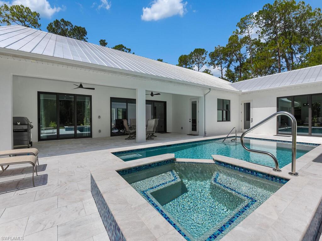 3475 3rd Avenue Southwest Naples, FL 34117 - Photo 5 of 49 a view of a house with lounge chair