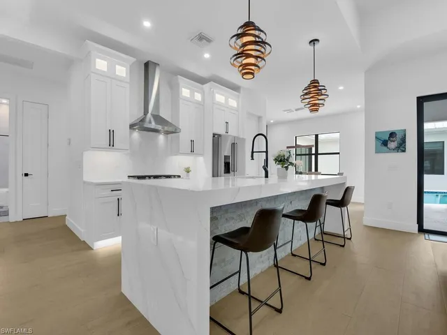 a kitchen with a dining table and chairs