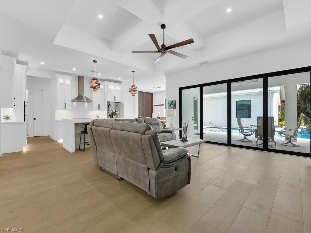 3475 3rd Avenue Southwest Naples, FL 34117 - Photo 7 of 49 a living room with furniture and large windows