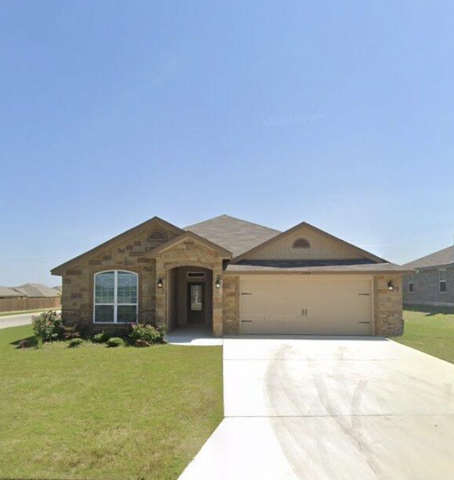 703 Ridgeview Drive Temple, TX 76502 - Photo 1 of 5 a front view of a house with a garden and yard