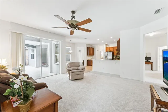 a bathroom with a granite countertop sink mirror and shower