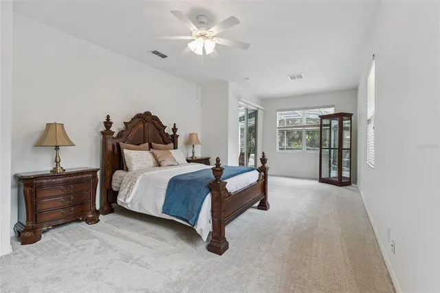 an empty room with closet and windows