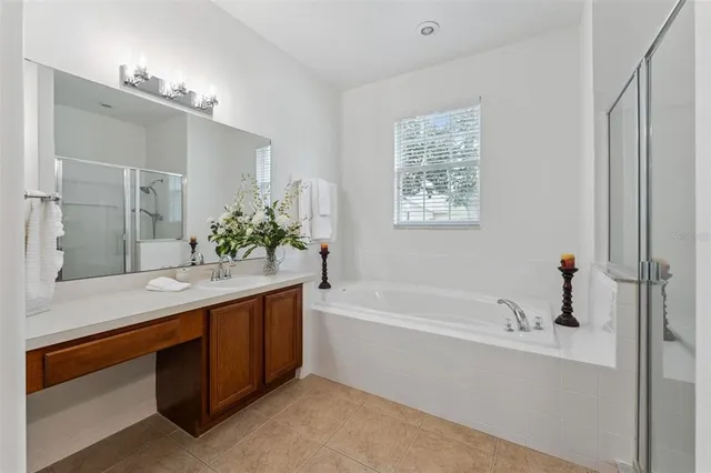 an empty room with fan and entrance