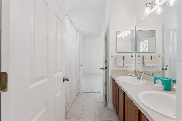 an aerial view of a house with a yard and lake view