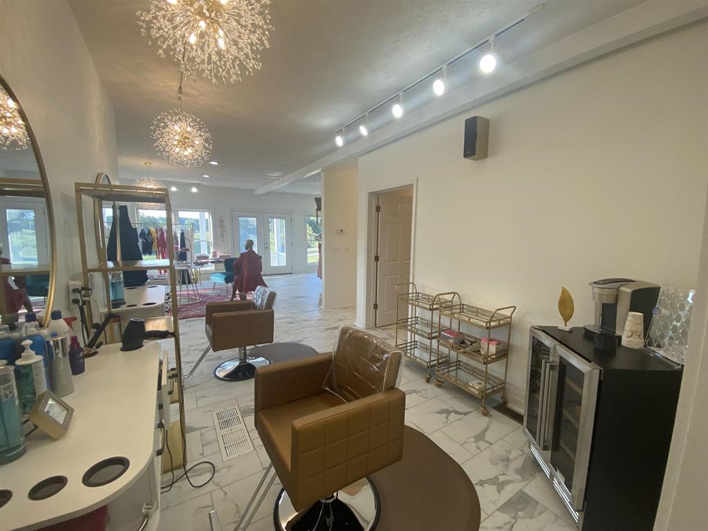 55 Old South Road Counce, TN 38326 - Photo 12 of 24 a living room with lots of furniture and a chandelier