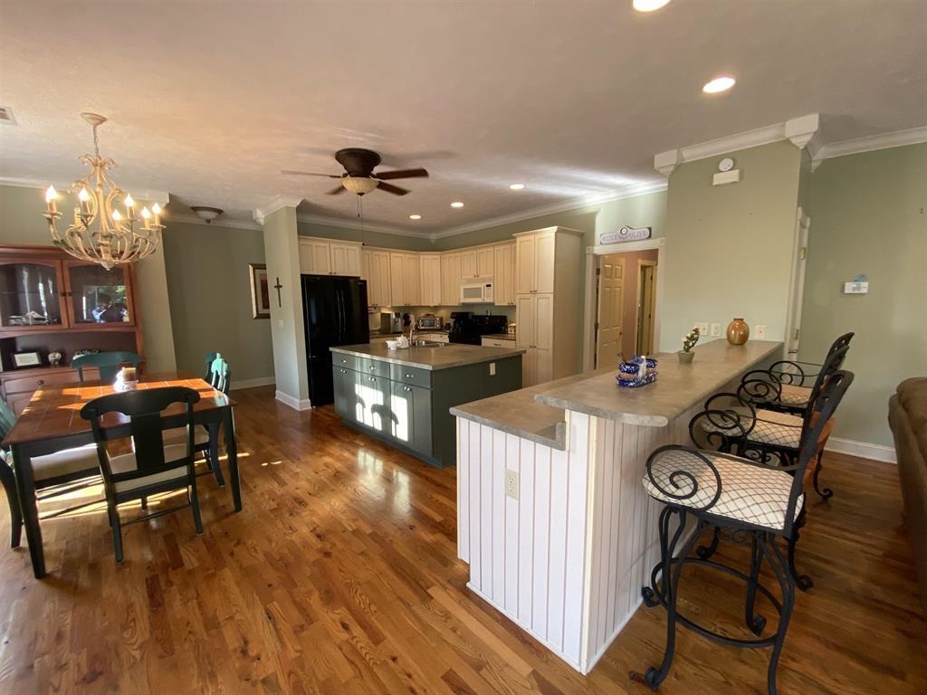 55 Old South Road Counce, TN 38326 - Photo 21 of 24 a view of a dining room with furniture and wooden floor