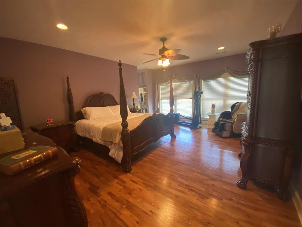 55 Old South Road Counce, TN 38326 - Photo 23 of 24 a bedroom with furniture and a chandelier