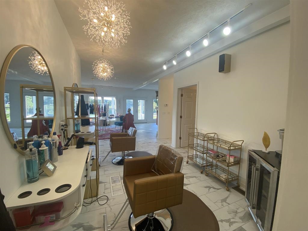 55 Old South Road Counce, TN 38326 - Photo 7 of 24 a living room with furniture and a chandelier