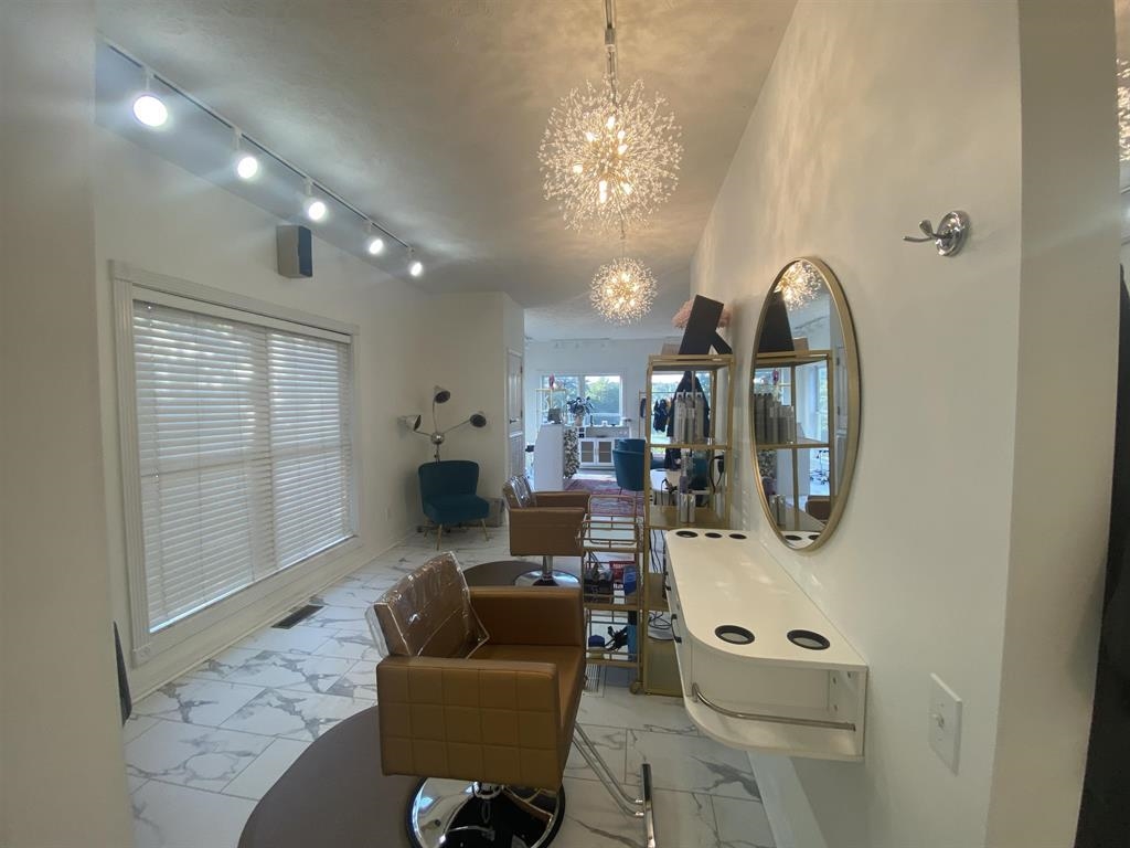 55 Old South Road Counce, TN 38326 - Photo 8 of 24 a living room with furniture and a chandelier