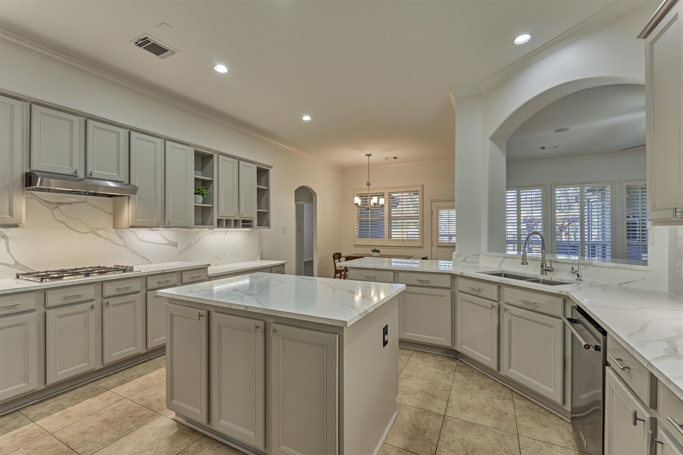 94 Oriel Oaks Circle The Woodlands, TX 77382 - Photo 14 of 46 a kitchen with sink stove and cabinets
