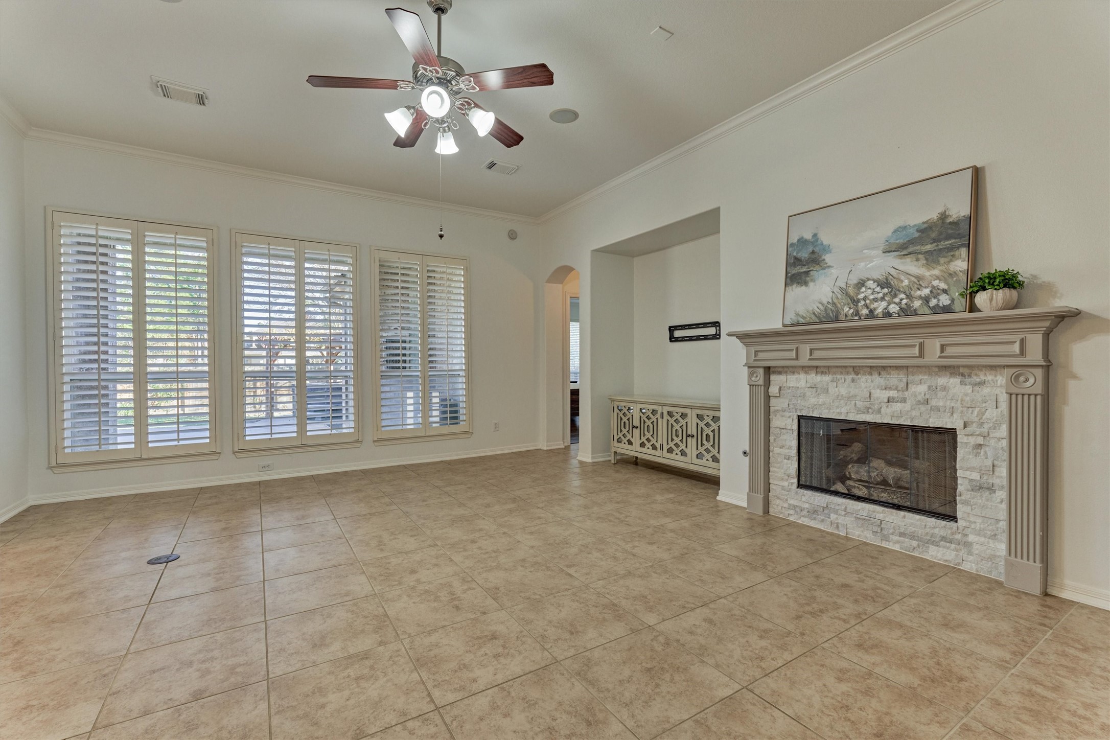 94 Oriel Oaks Circle The Woodlands, TX 77382 - Photo 22 of 46 a view of an empty room with a fireplace and a window