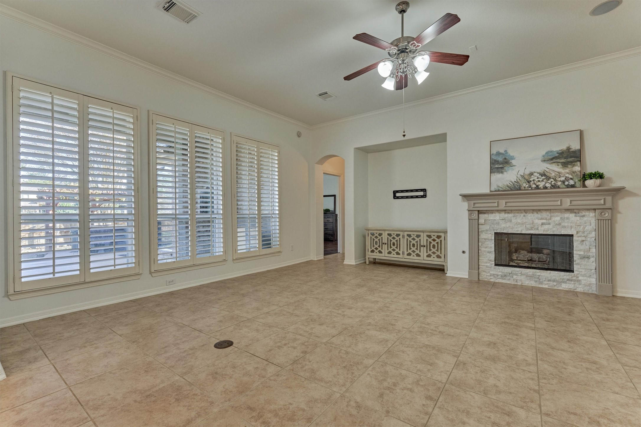 94 Oriel Oaks Circle The Woodlands, TX 77382 - Photo 25 of 46 a view of an empty room with a fireplace and a window