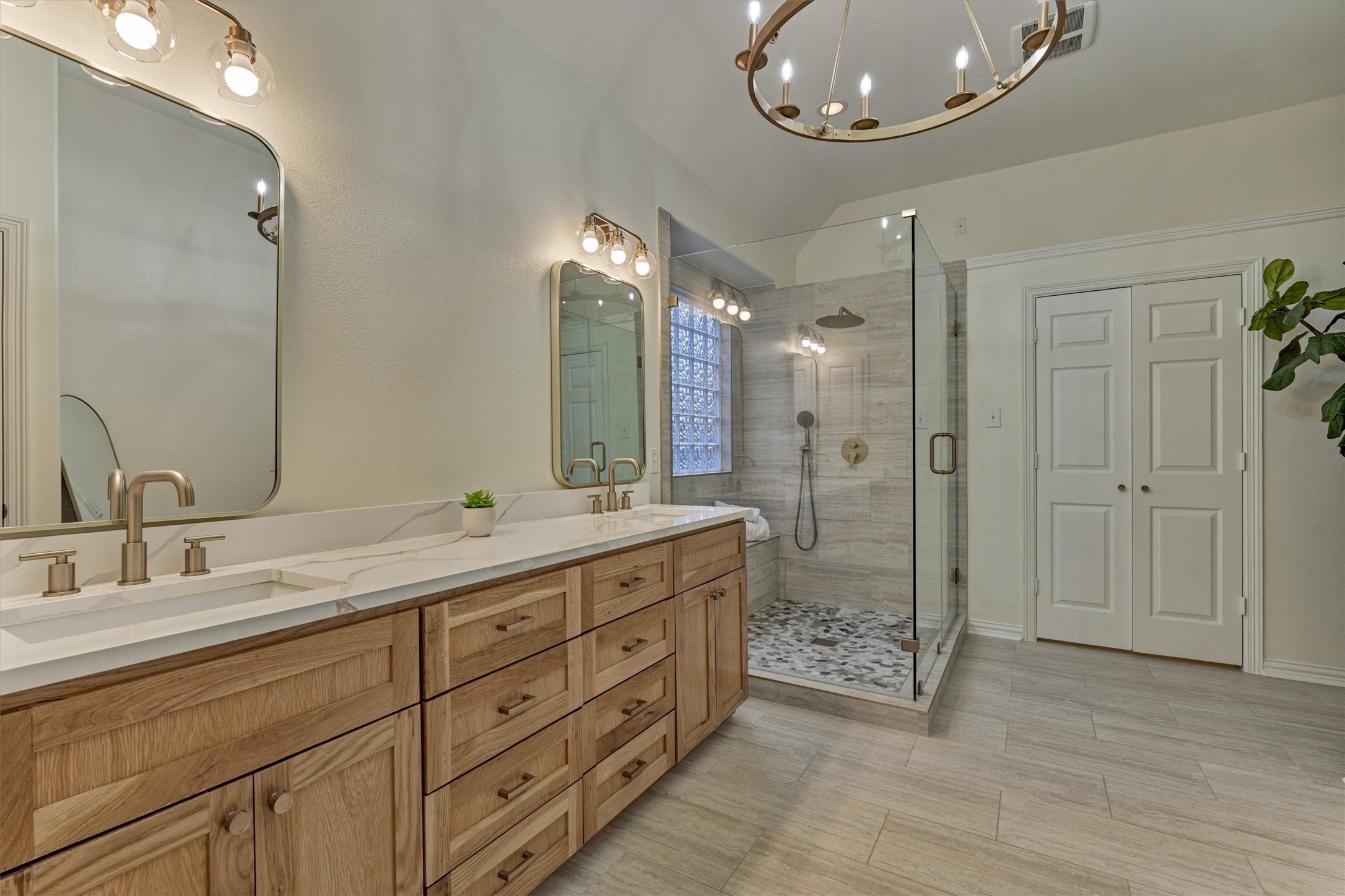 94 Oriel Oaks Circle The Woodlands, TX 77382 - Photo 29 of 46 a bathroom with a double vanity sink mirror double and shower