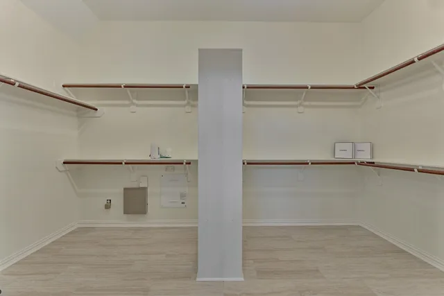 a view of an empty walk in closet