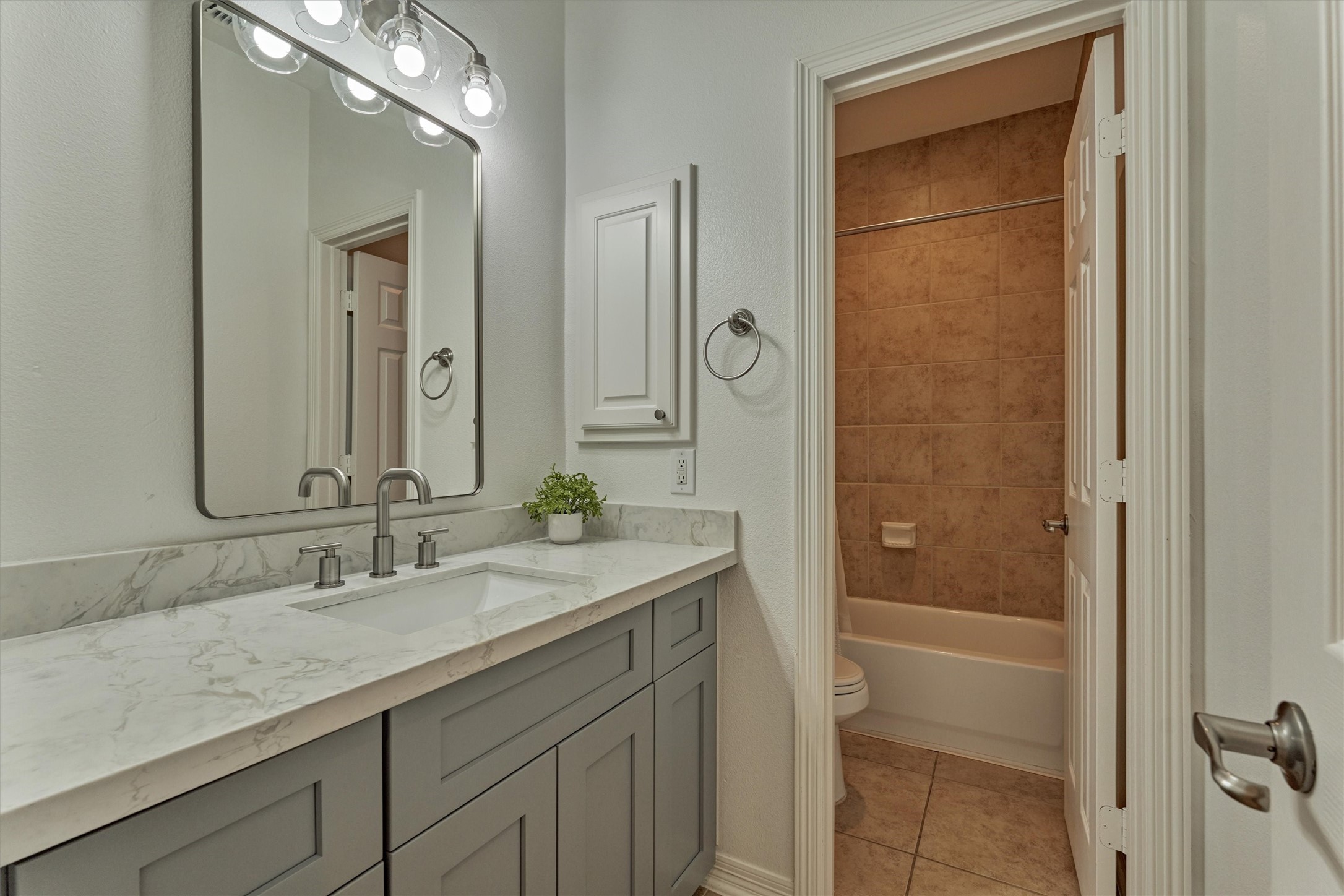 94 Oriel Oaks Circle The Woodlands, TX 77382 - Photo 35 of 46 a bathroom with a granite countertop sink shower and a mirror