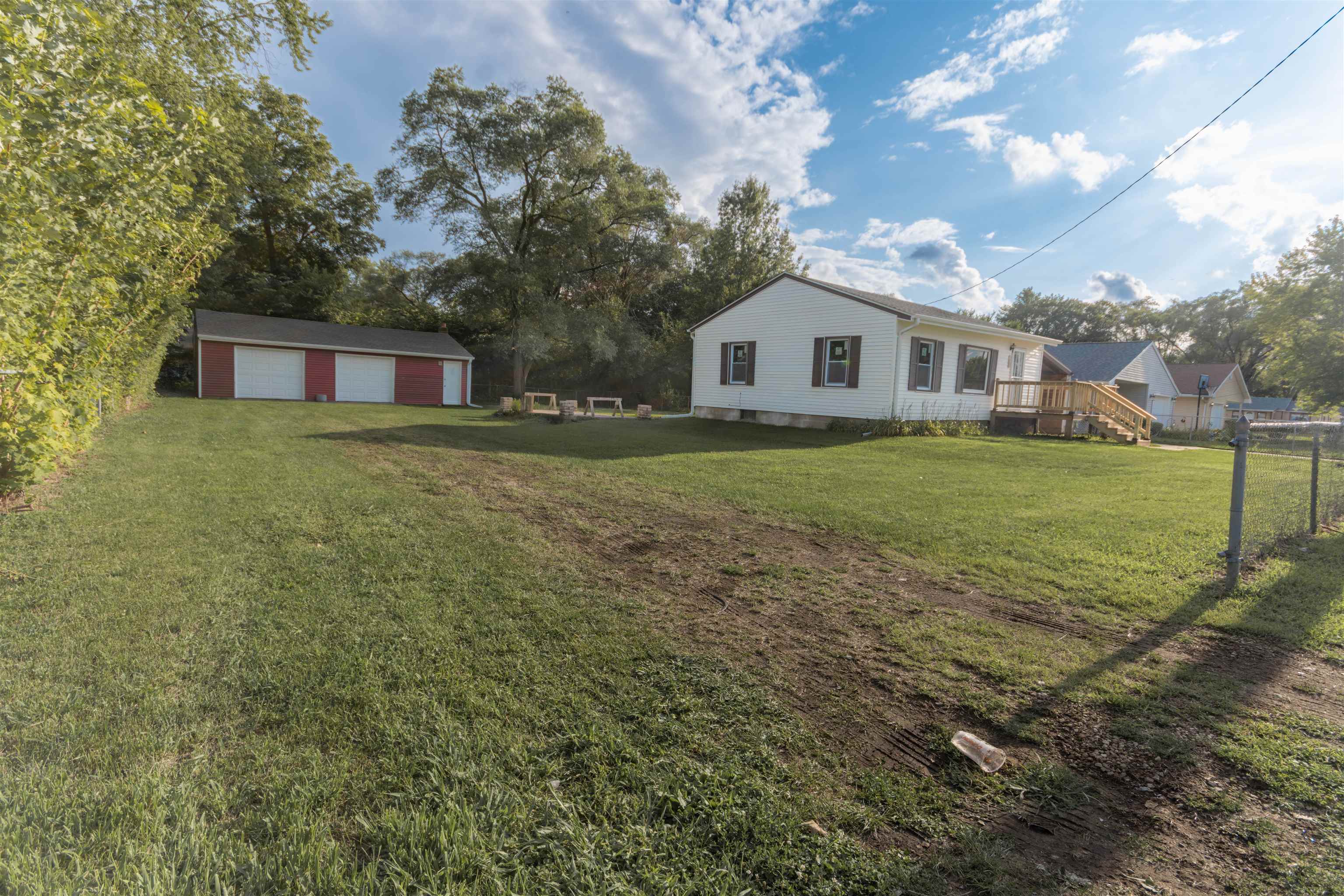 3412 Gilbert Avenue Rockford, IL 61101 - Photo 18 of 19 a front view of a house with a garden