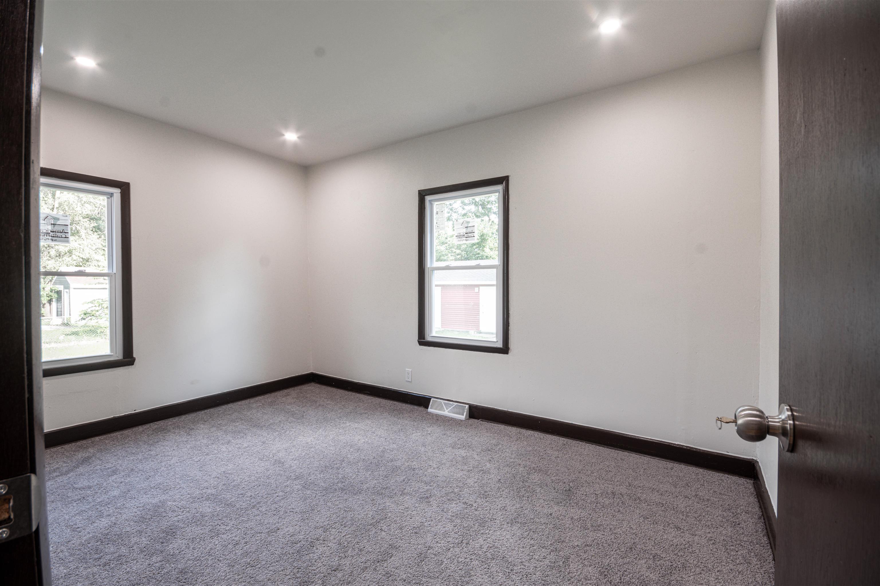 3412 Gilbert Avenue Rockford, IL 61101 - Photo 6 of 19 an empty room with windows