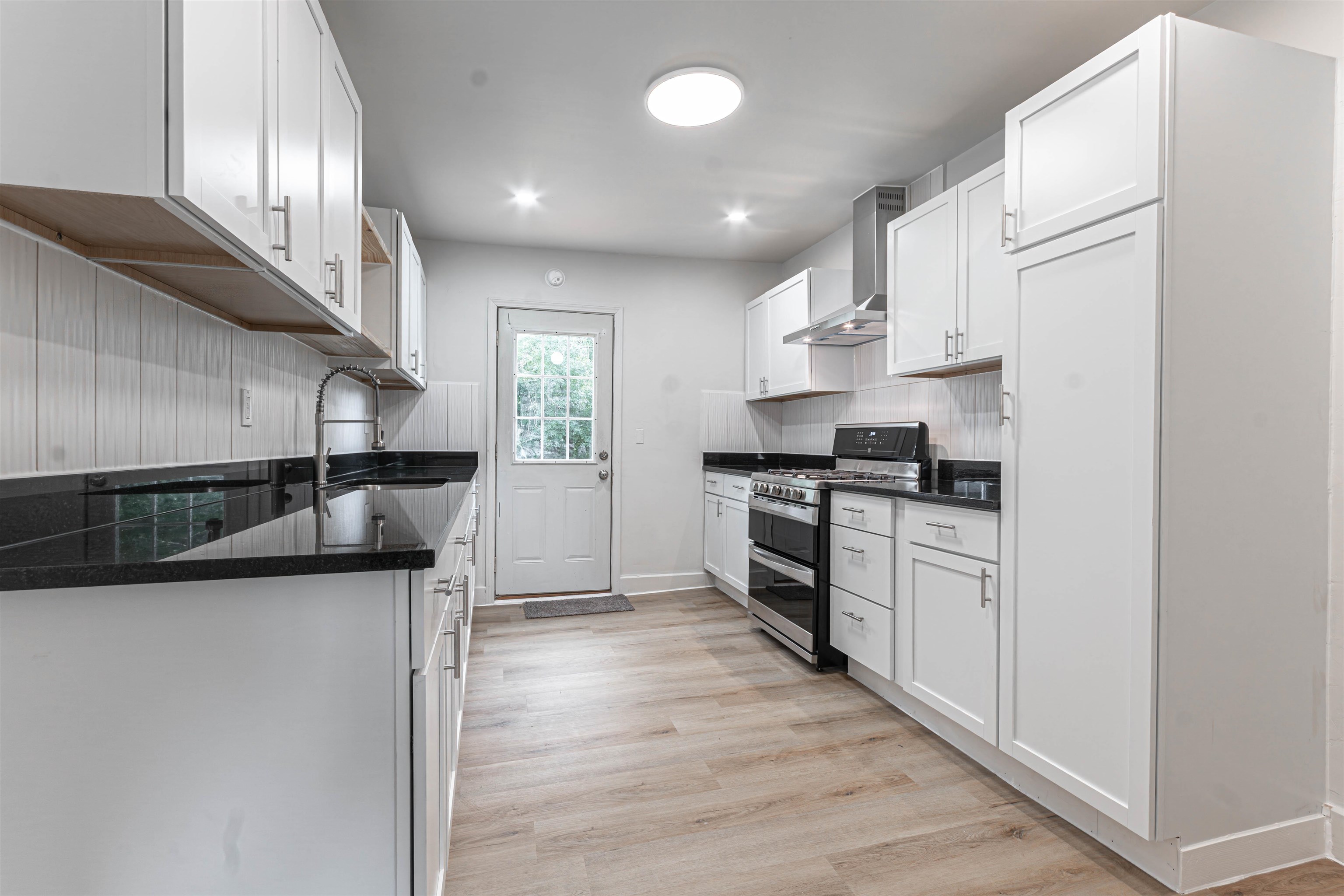 3412 Gilbert Avenue Rockford, IL 61101 - Photo 9 of 19 a kitchen with stainless steel appliances granite countertop a sink and cabinets