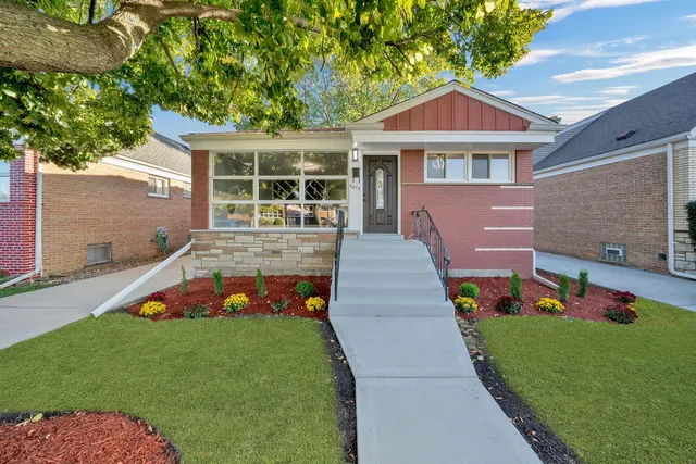 a view of house with a yard
