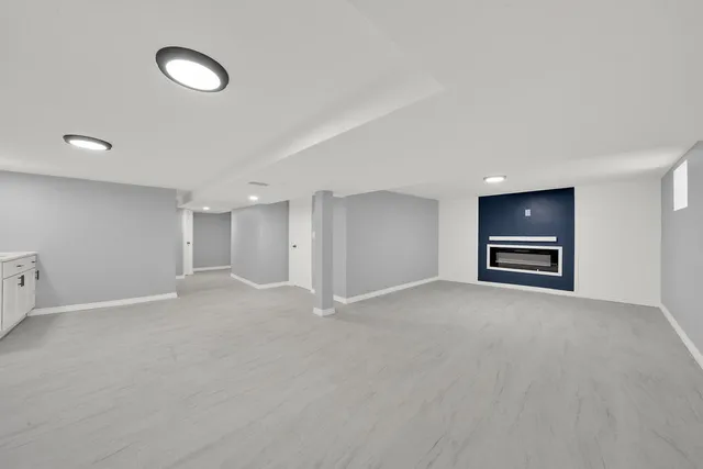 a view of an empty room with a sink