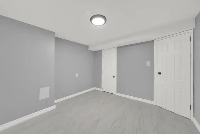 a bathroom with a sink mirror and toilet