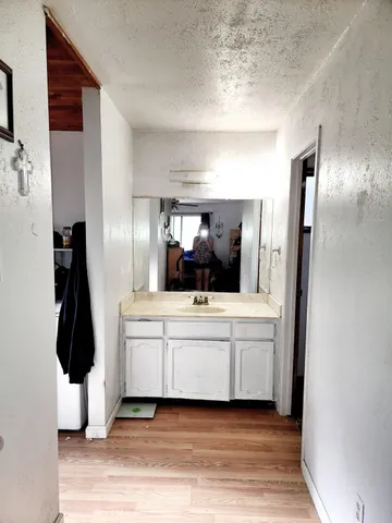 a bathroom with a glass shower door