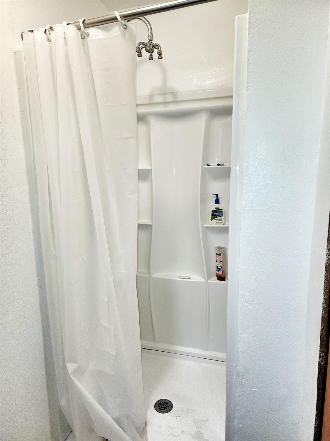 3221 Brauer Road Georgetown, CA 95634 - Photo 14 of 24 a bathroom with a glass shower door