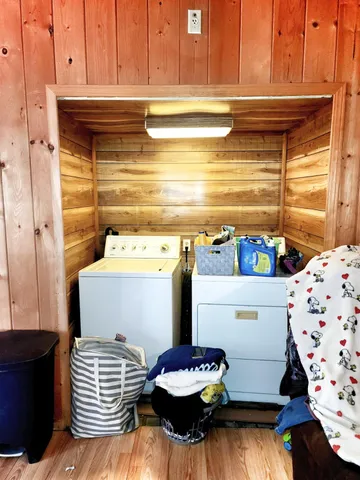 a backyard of a house with table and chairs