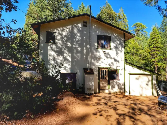 a brick house with a small yard