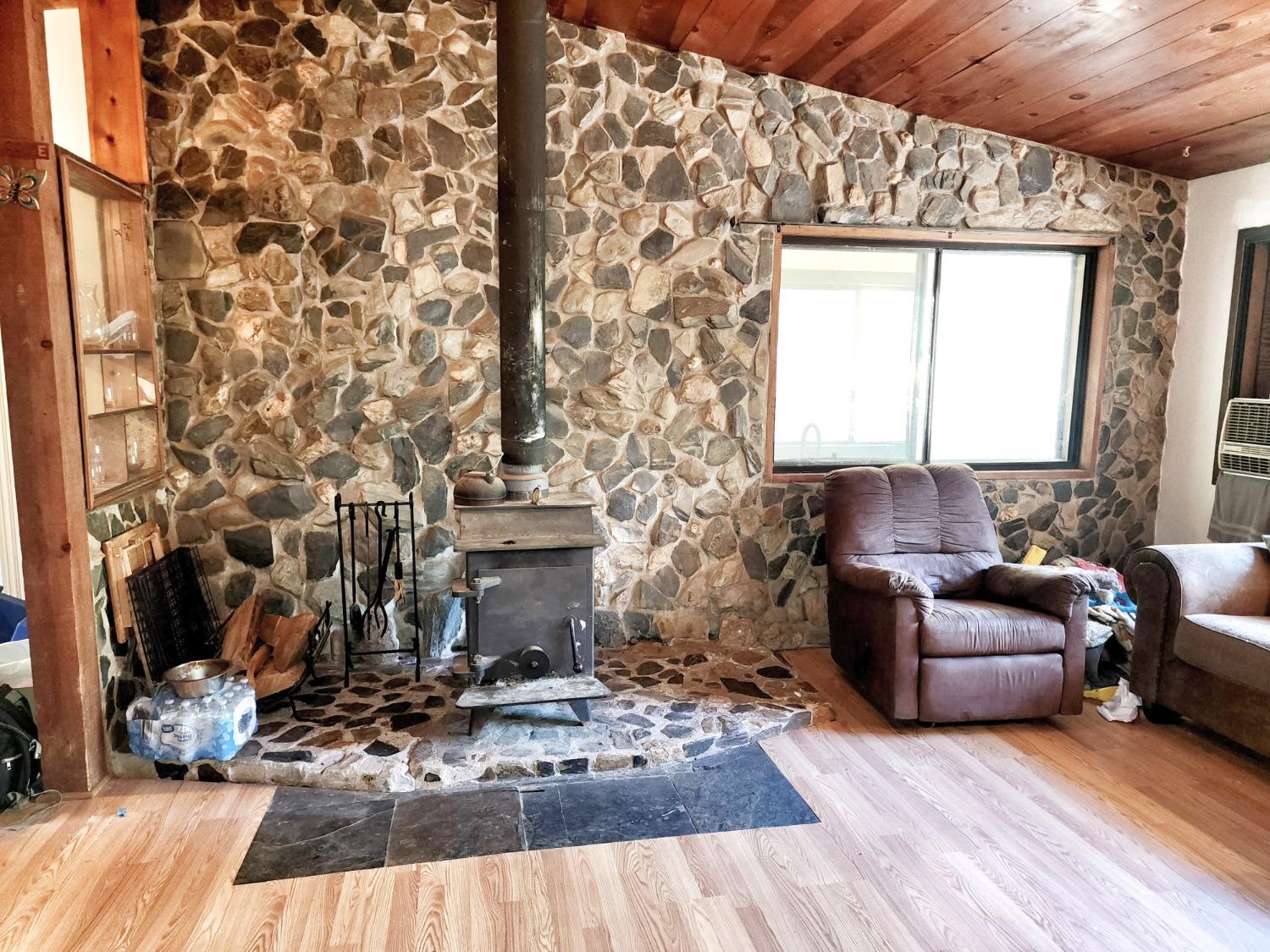 3221 Brauer Road Georgetown, CA 95634 - Photo 3 of 24 a living room with furniture and a fireplace