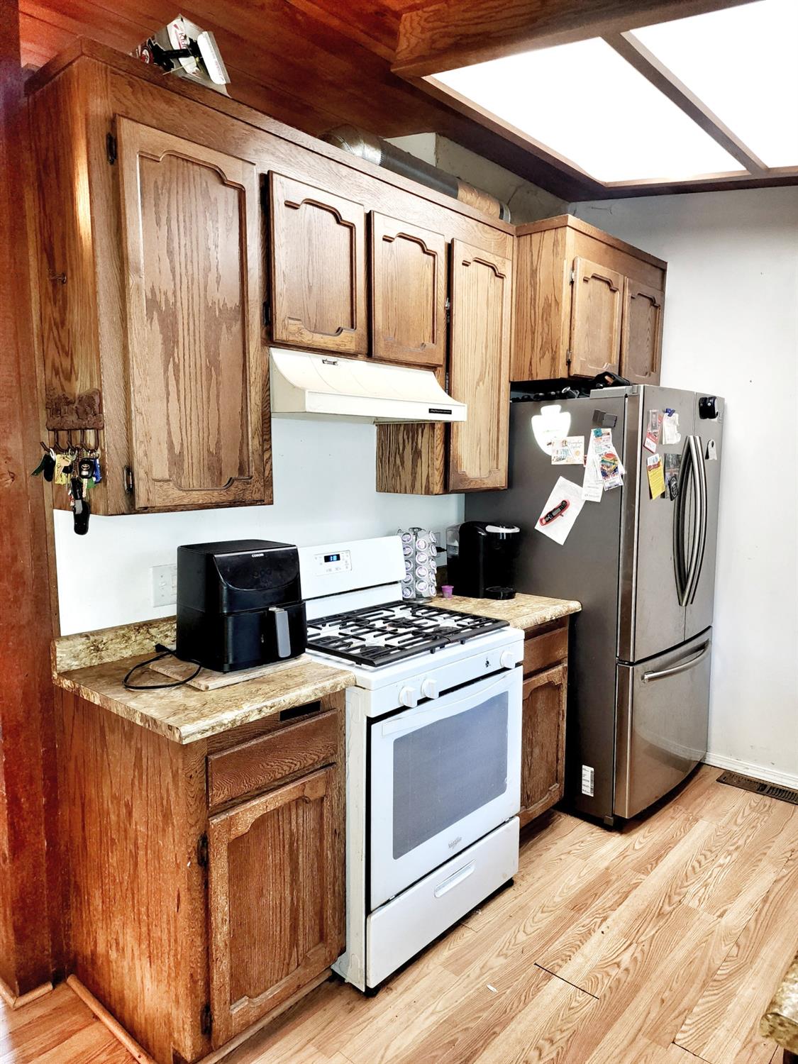 3221 Brauer Road Georgetown, CA 95634 - Photo 8 of 24 a kitchen with stainless steel appliances granite countertop a stove and a refrigerator
