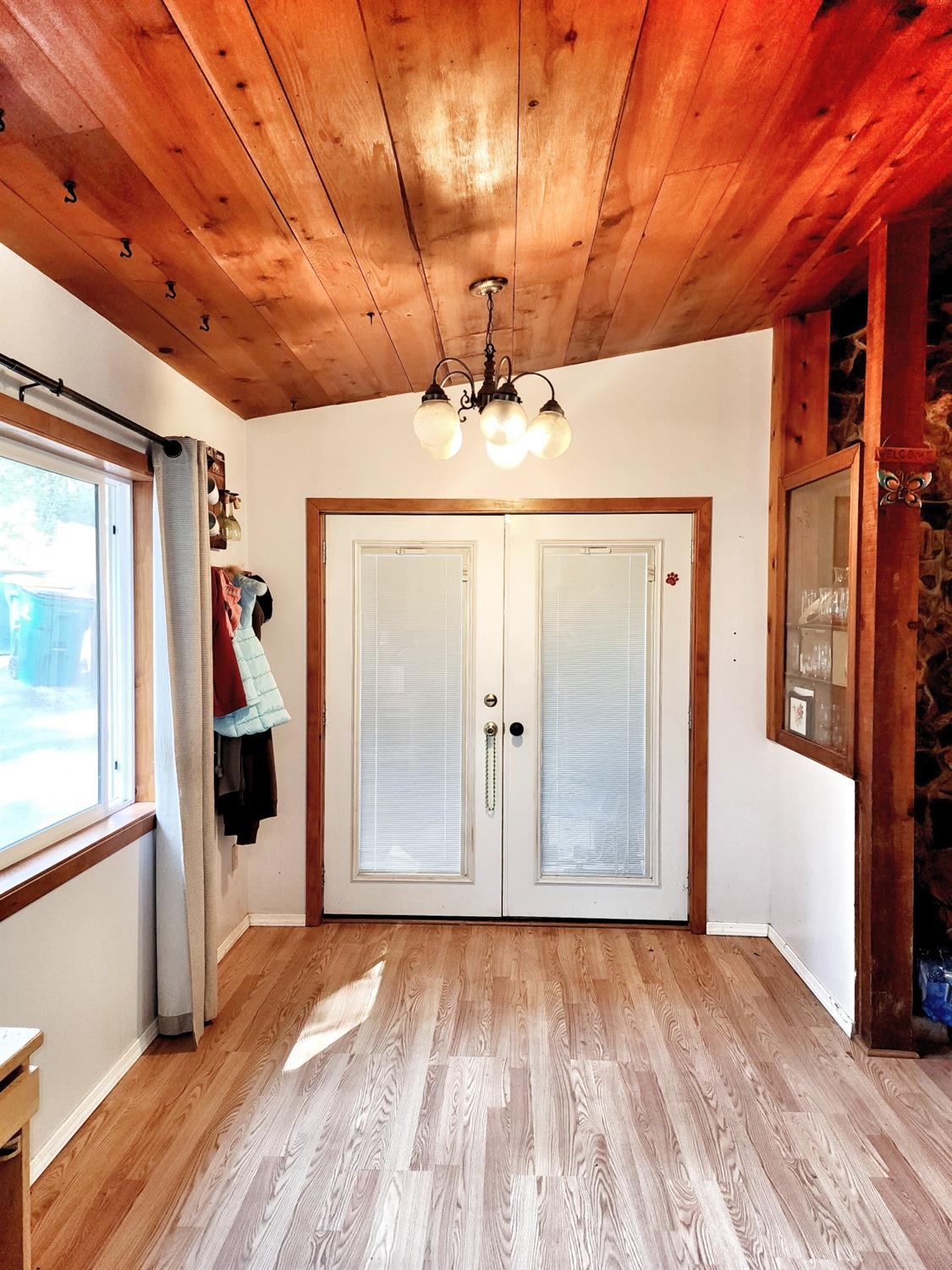 3221 Brauer Road Georgetown, CA 95634 - Photo 9 of 24 a view of a room with wooden floor and window