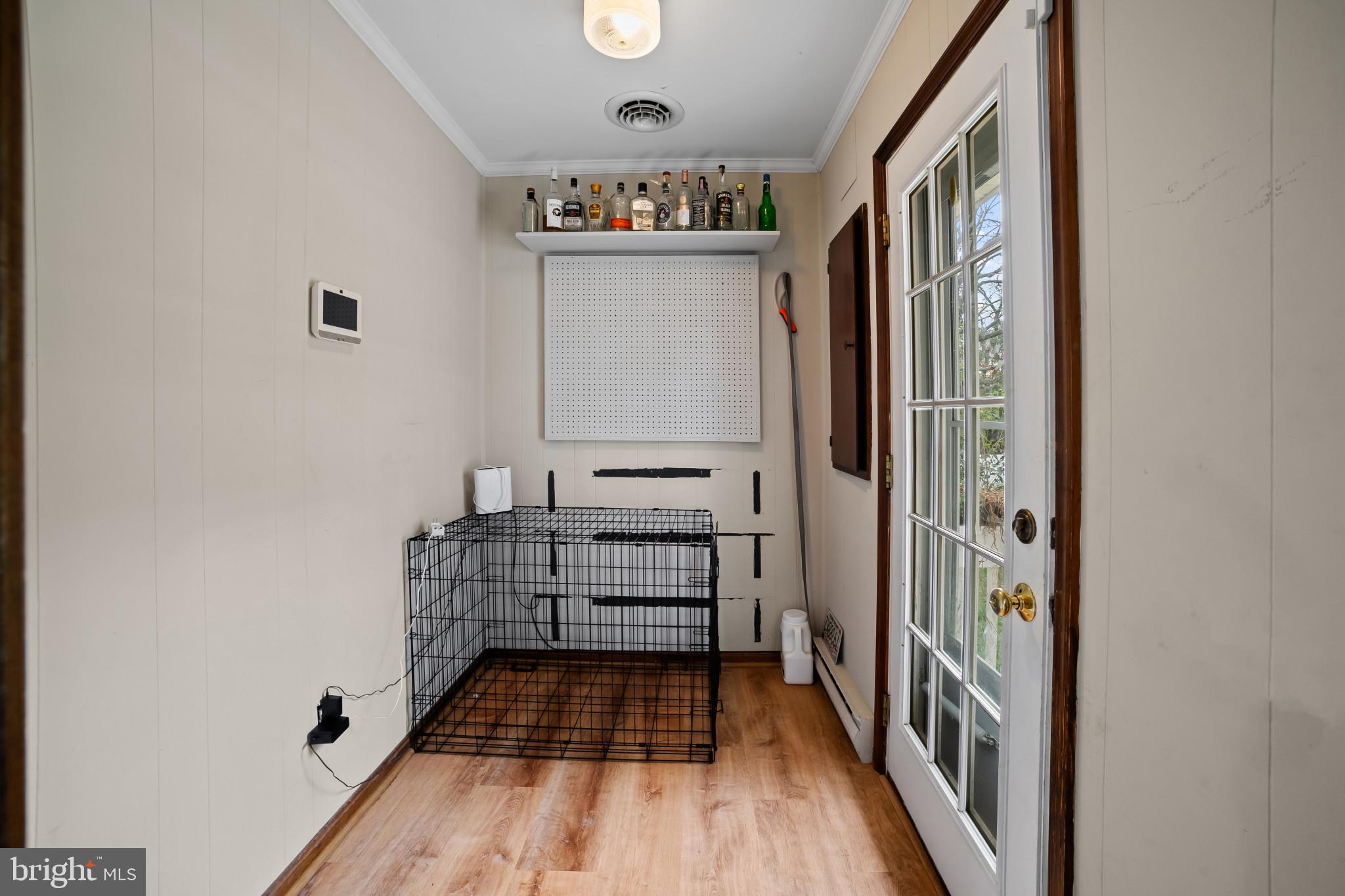 10444 Worton Road Worton, MD 21678 - Photo 11 of 25 a view of a hallway with wooden floor and staircase
