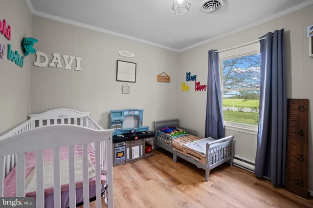 a bedroom with furniture and a window