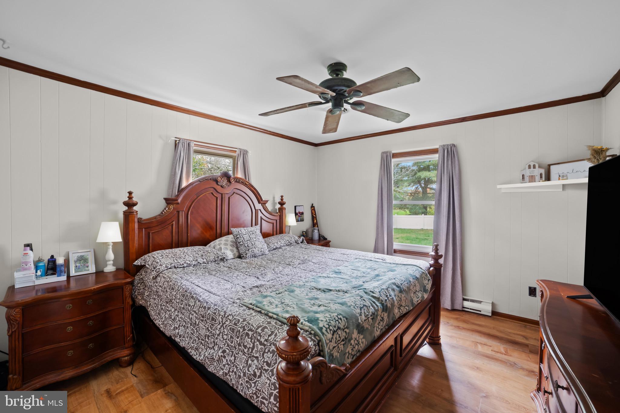 10444 Worton Road Worton, MD 21678 - Photo 16 of 25 a bedroom with a bed and a dresser