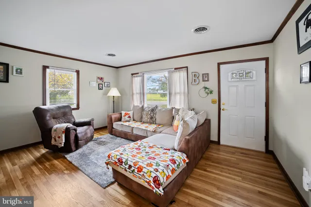 a living room with furniture and a rug