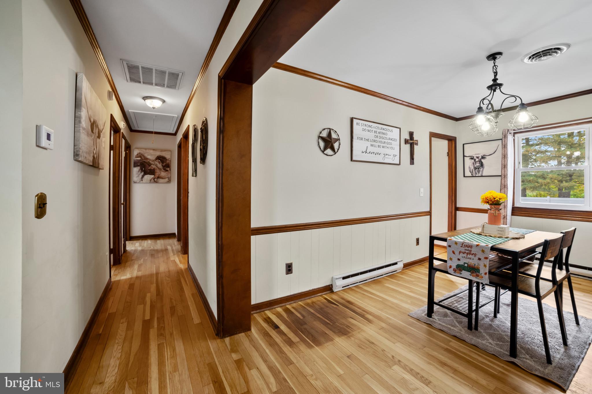 10444 Worton Road Worton, MD 21678 - Photo 6 of 25 a view of a hallway with wooden floor and furniture