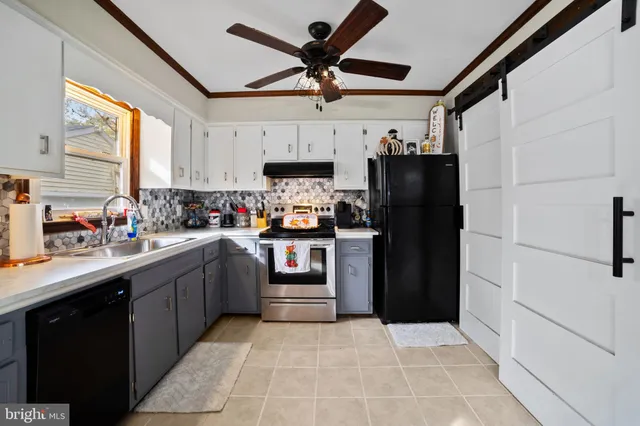 a kitchen with a refrigerator and a sink
