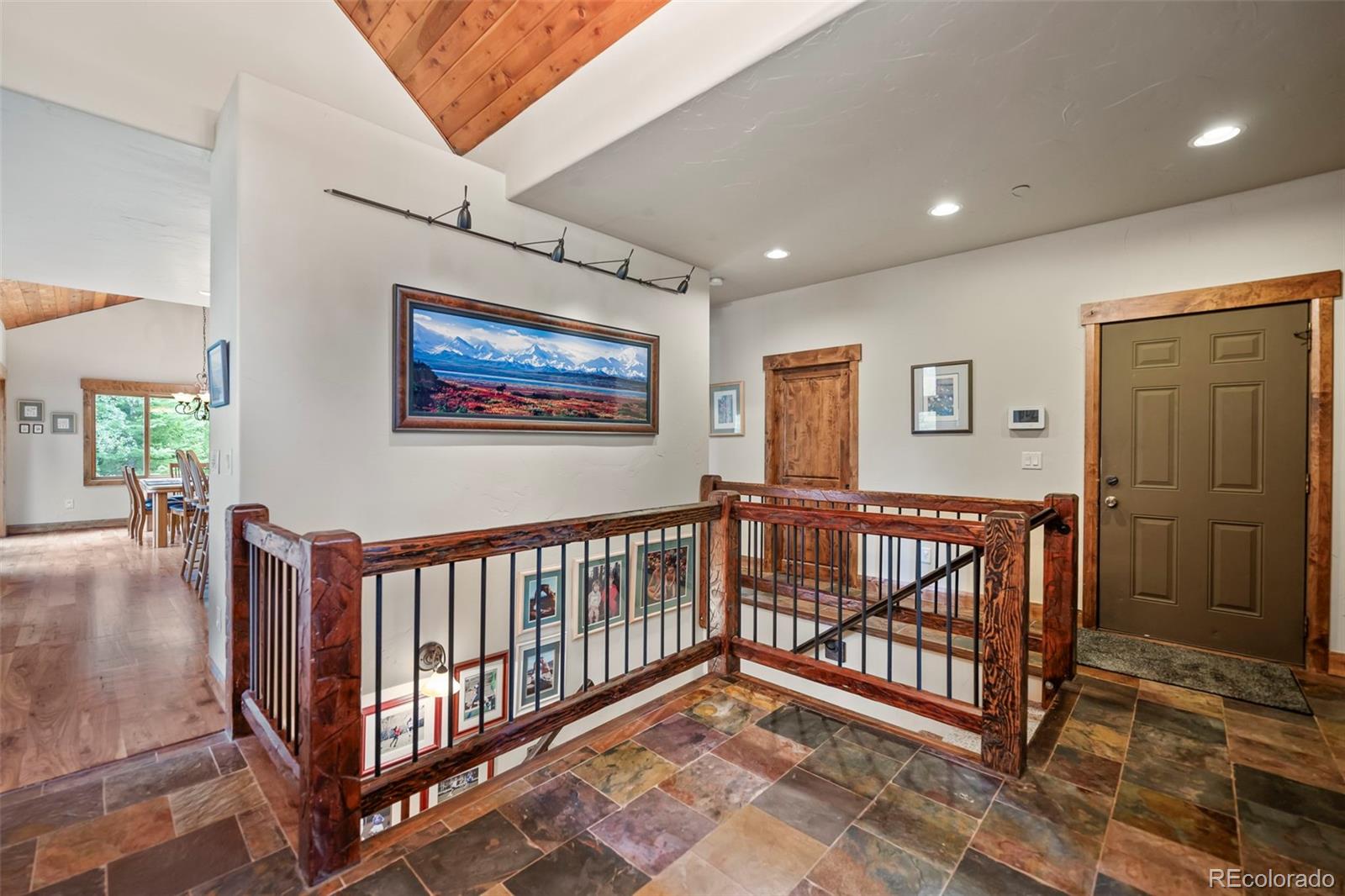 560 Two Cabins Drive Silverthorne, CO 80498 - Photo 3 of 49 a view of hallway with wooden floor and stairs