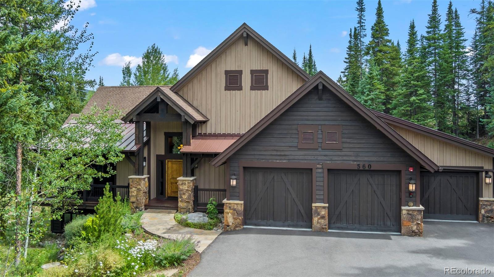 560 Two Cabins Drive Silverthorne, CO 80498 - Photo 35 of 49 a front view of a house with garden