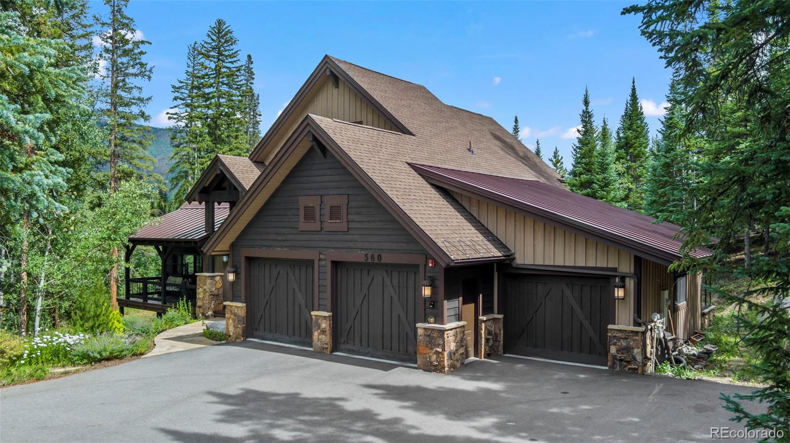 560 Two Cabins Drive Silverthorne, CO 80498 - Photo 36 of 49 a front view of a house with garden