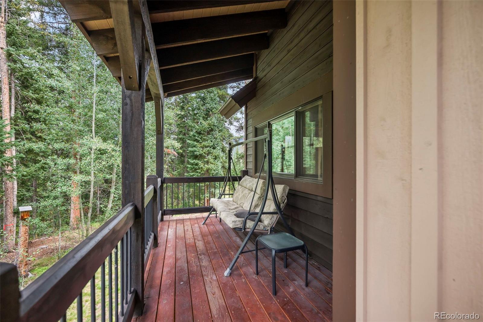 560 Two Cabins Drive Silverthorne, CO 80498 - Photo 38 of 49 a view of balcony with chairs and wooden fence