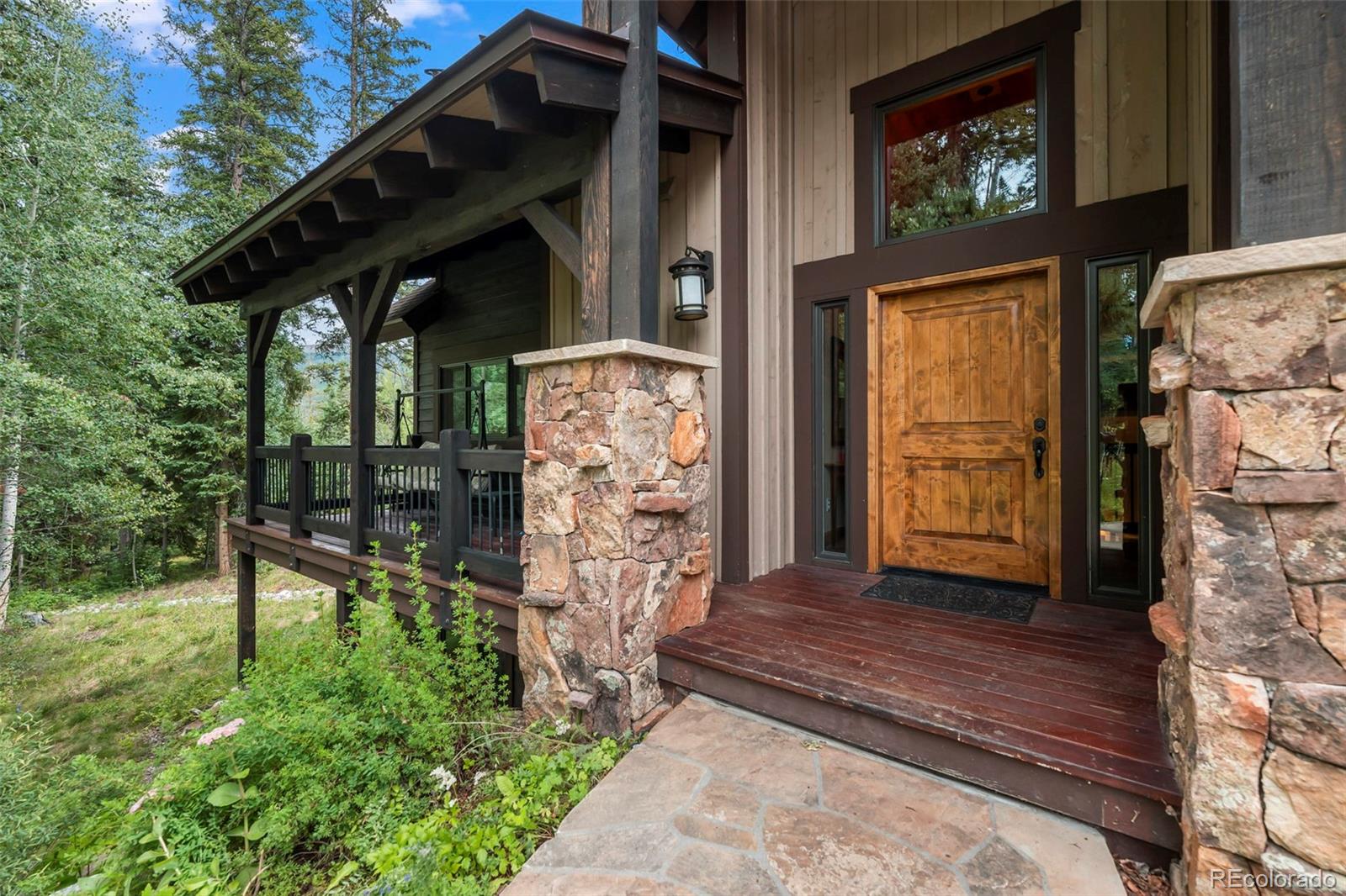 560 Two Cabins Drive Silverthorne, CO 80498 - Photo 39 of 49 a view of house with entryway and wooden walls