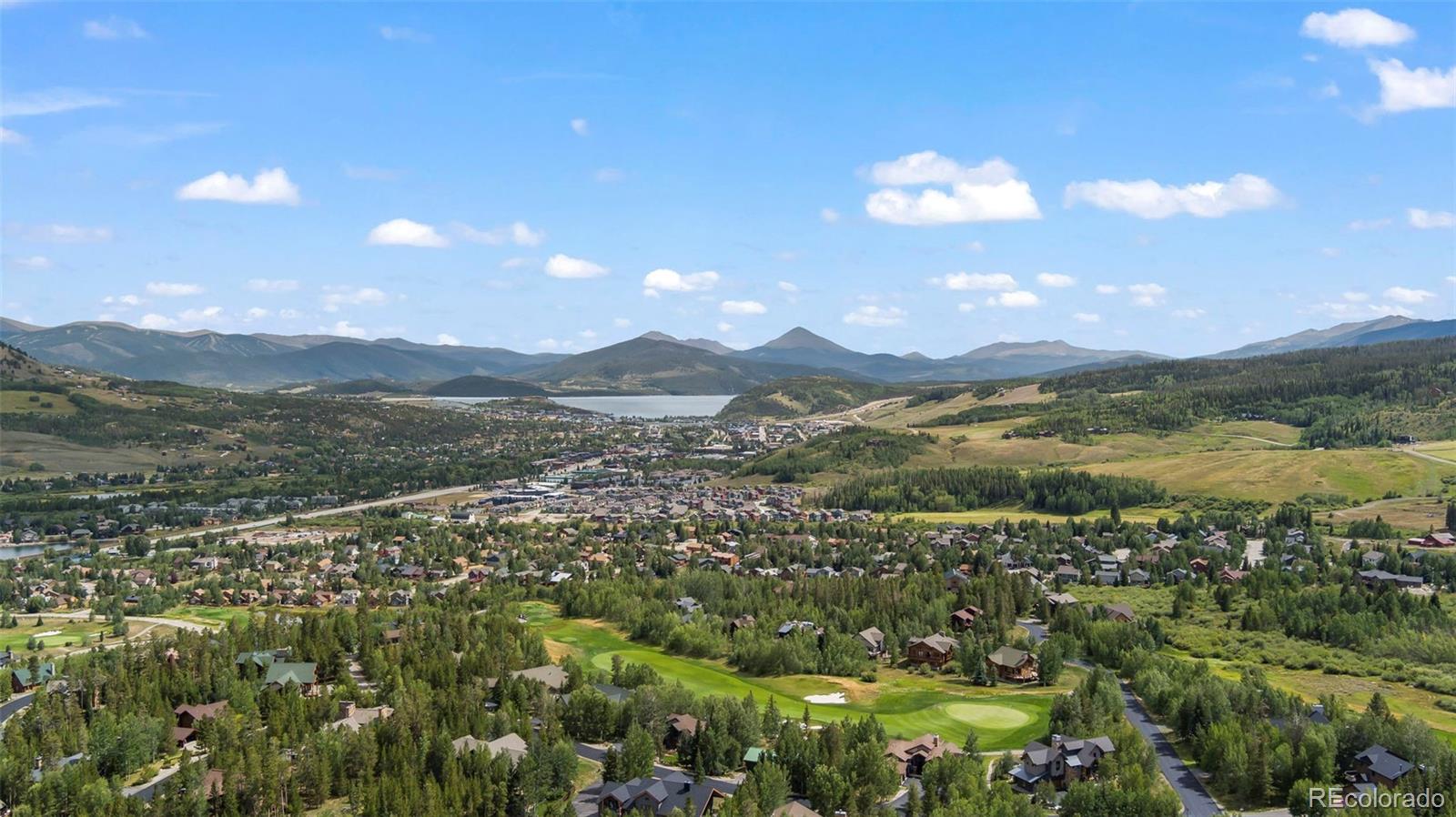 560 Two Cabins Drive Silverthorne, CO 80498 - Photo 42 of 49 a view of a city with mountains in the background