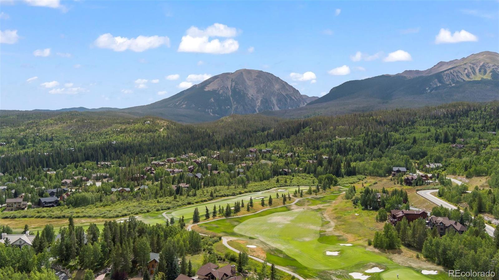 560 Two Cabins Drive Silverthorne, CO 80498 - Photo 43 of 49 a view of a city with mountains in the background