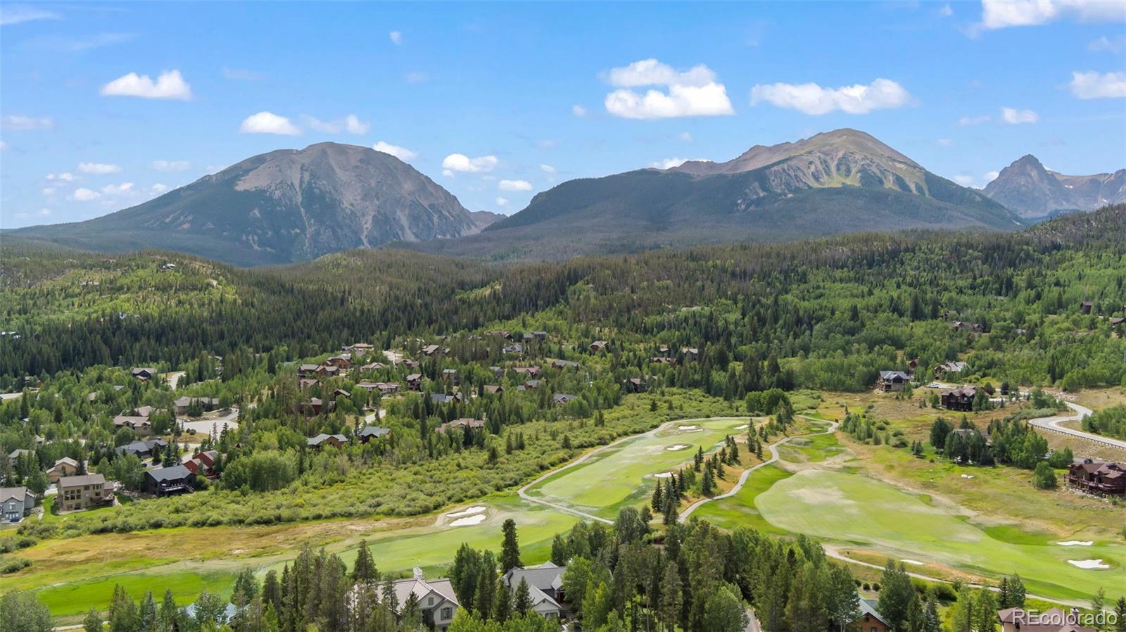 560 Two Cabins Drive Silverthorne, CO 80498 - Photo 44 of 49 a view of a lake with a mountain in the background