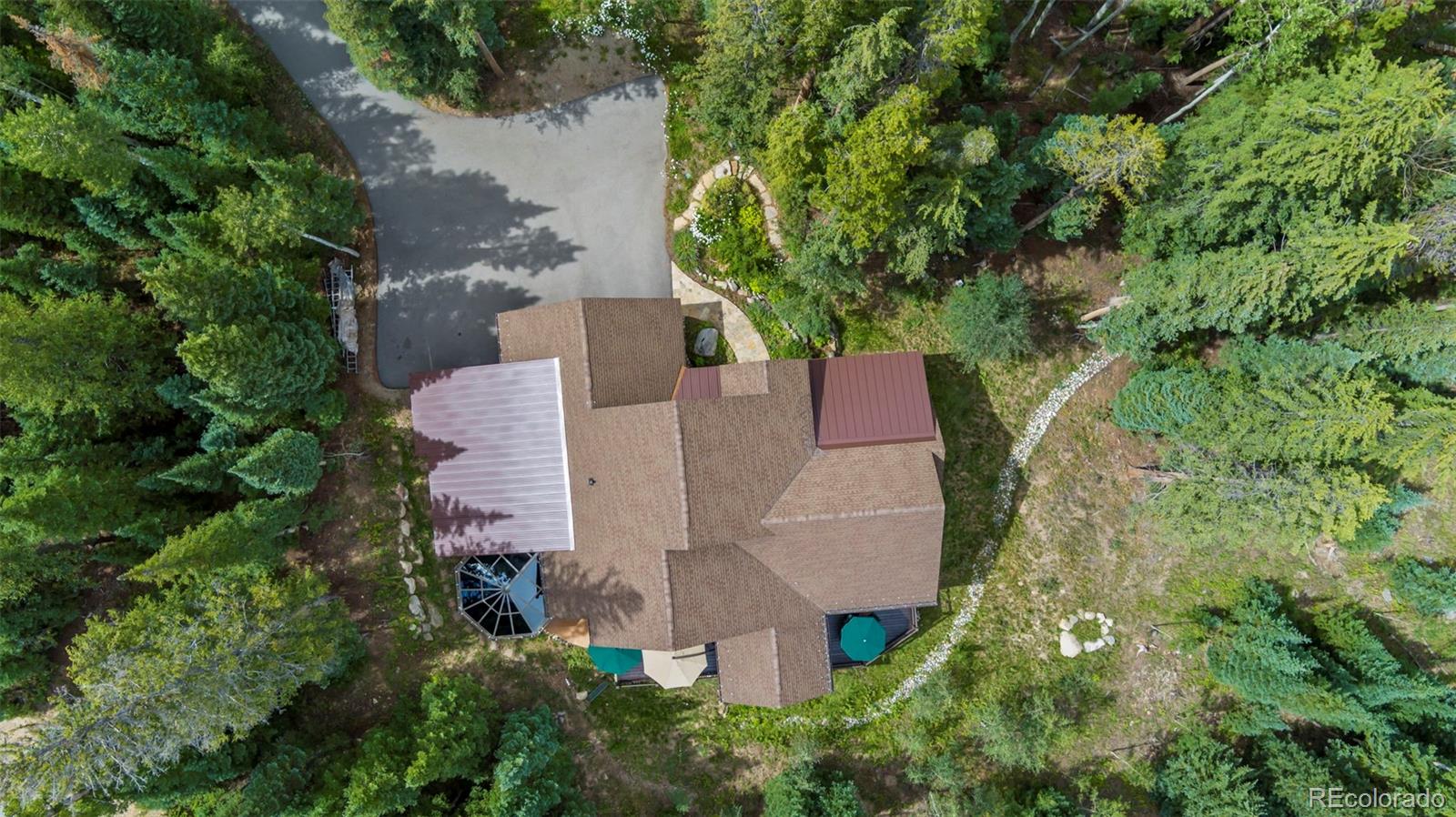 560 Two Cabins Drive Silverthorne, CO 80498 - Photo 45 of 49 an aerial view of a house with yard and outdoor seating