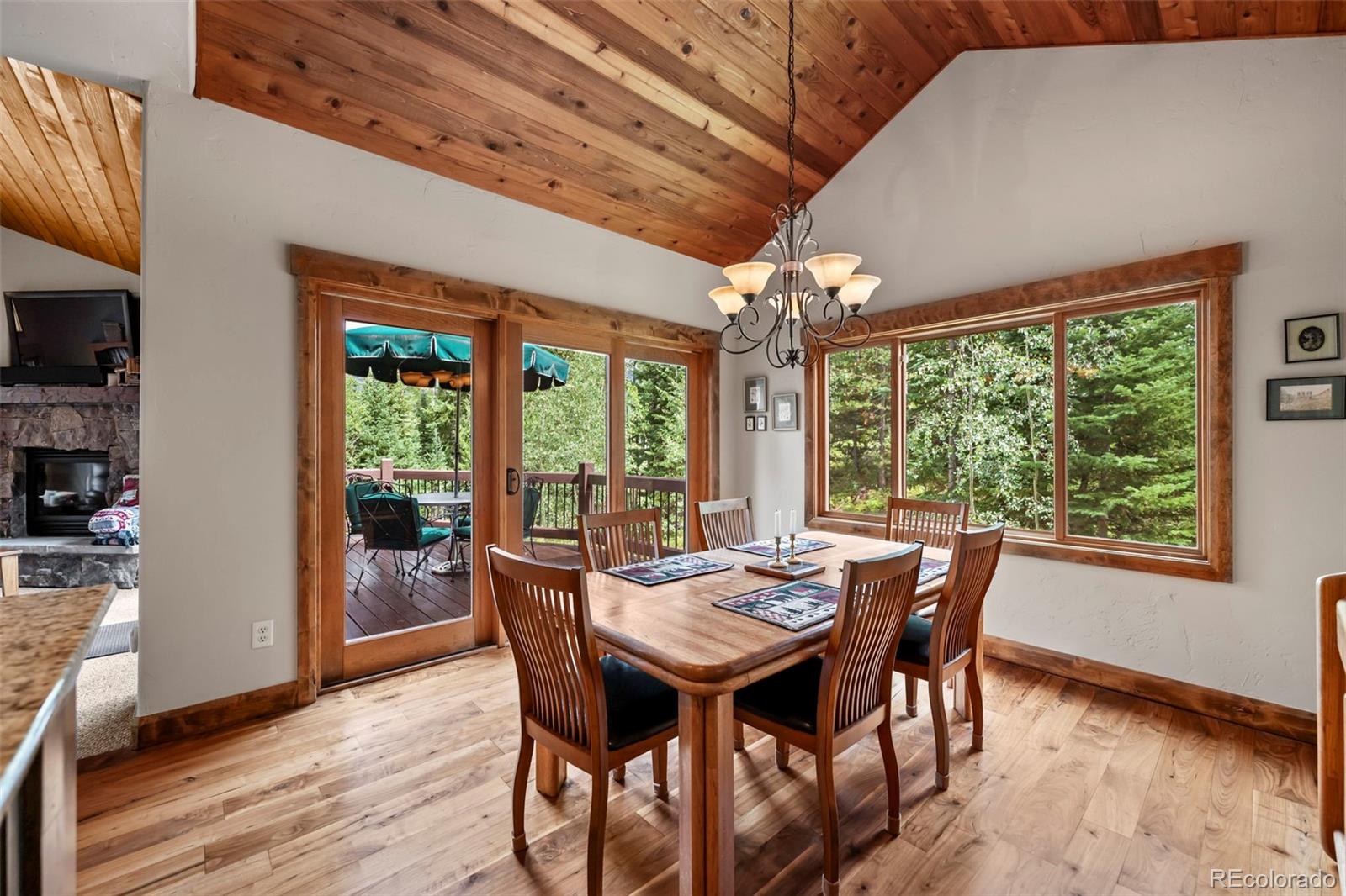 560 Two Cabins Drive Silverthorne, CO 80498 - Photo 8 of 49 a view of a dining room with furniture window and wooden floor