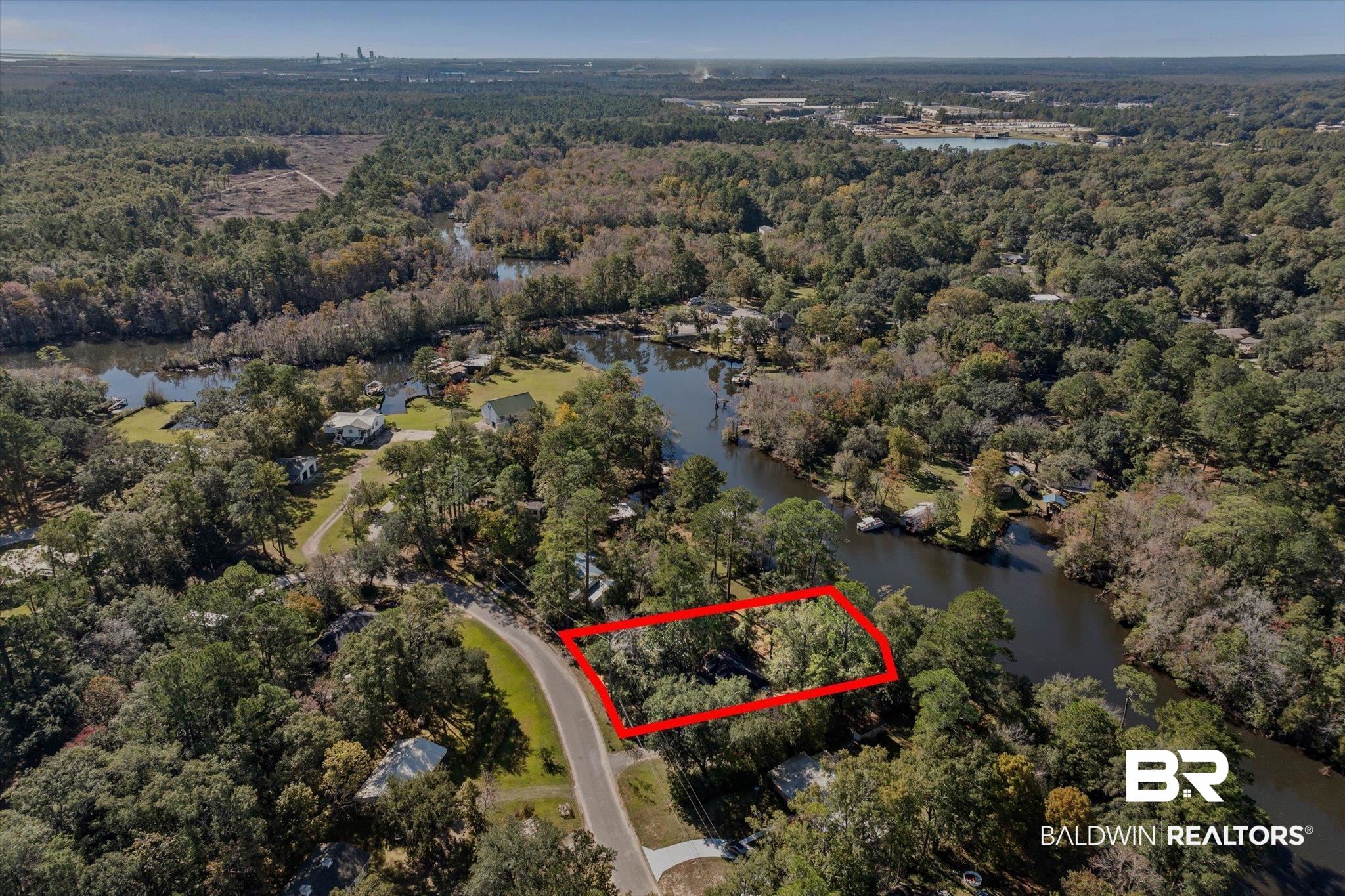 431 Simms Drive Saraland, AL 36571 - Photo 24 of 34 Aerial view of property and surrounding area featuring property boundaries highlighted and a large body of water