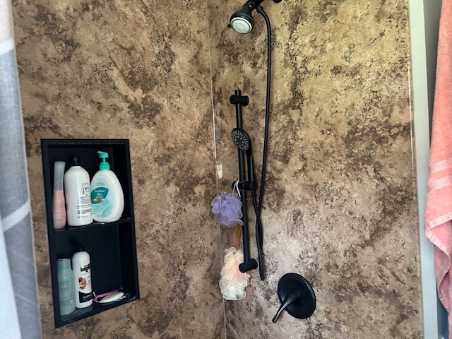102 Cofer Drive Springfield, TN 37172 - Photo 10 of 18 a bathroom with a granite countertop shower a sink and a mirror